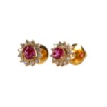 A PAIR OF RUBY AND DIAMOND CLUSTER EARRINGS