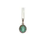 AN EMERALD AND DIAMOND PENDANT