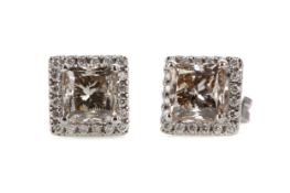 A PAIR OF DIAMOND STUD EARRINGS