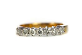 A CERTIFICATED DIAMOND SEVEN STONE RING