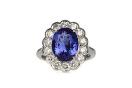 A TANZANITE AND DIAMOND RING