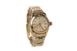 A LADY'S ROLEX OYSTER PERPETUAL FOURTEEN CARAT GOLD AUTOMATIC WRIST WATCH