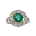 AN EMERALD AND DIAMOND RING