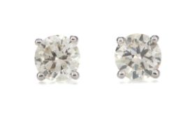 A PAIR OF CERTIFICATED DIAMOND STUD EARRINGS