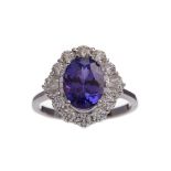 A CERTIFICATED TANZANITE AND DIAMOND RING