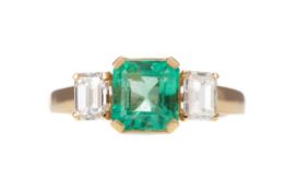 AN EMERALD AND DIAMOND RING