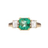 AN EMERALD AND DIAMOND RING