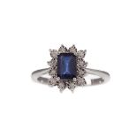 A SAPPHIRE AND DIAMOND RING