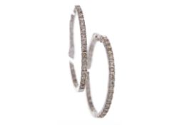 A PAIR OF DIAMOND HOOP EARRINGS