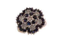 A SAPPHIRE AND DIAMOND CLUSTER RING