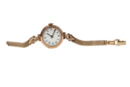 A LADY'S NINE CARAT GOLD CASED MANUAL WIND WRIST WATCH