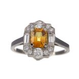 A CERTIFICATED YELLOW SAPPHIRE AND DIAMOND RING