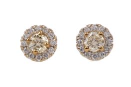 A PAIR OF CERTIFICATED YELLOW DIAMOND STUD EARRINGS