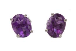 A PAIR OF AMETHYST STUD EARRINGS