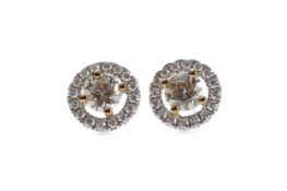 A PAIR OF YELLOW DIAMOND STUD EARRINGS