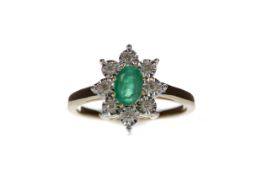 AN EMERALD AND DIAMOND CLUSTER RING