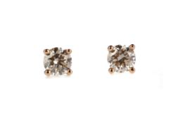 A PAIR OF DIAMOND STUD EARRINGS