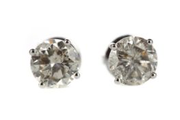 A PAIR OF DIAMOND STUD EARRINGS