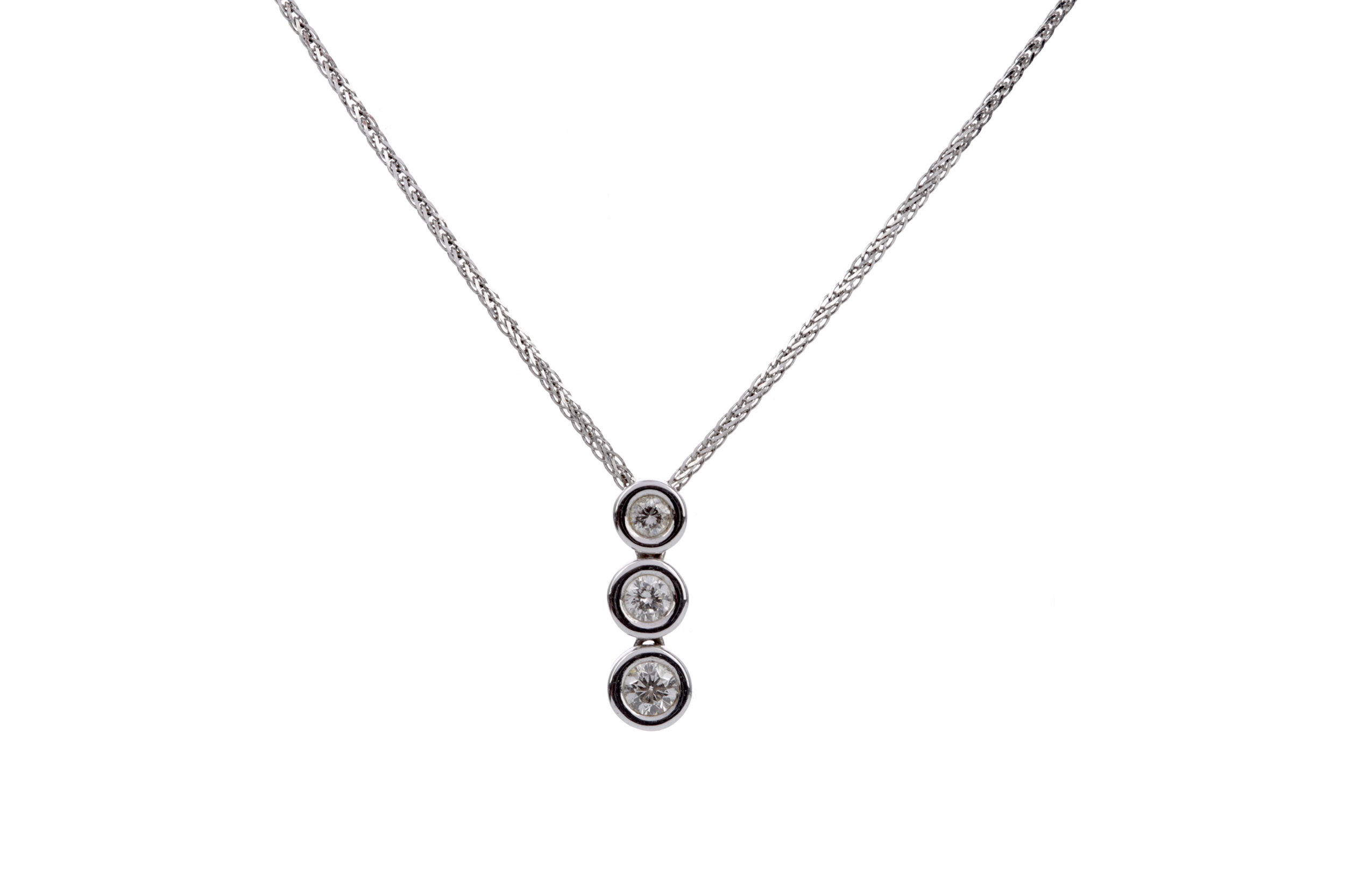 A DIAMOND THREE STONE PENDANT