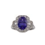 A TANZANITE AND DIAMOND RING