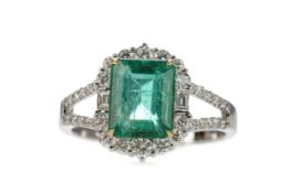 AN EMERALD AND DIAMOND RING