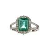 AN EMERALD AND DIAMOND RING