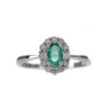 A CERTIFICATED EMERALD AND DIAMOND RING