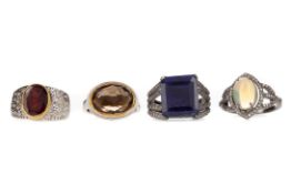 FOUR GEM SET RINGS