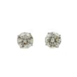 A PAIR OF IMPRESSIVE DIAMOND STUD EARRINGS