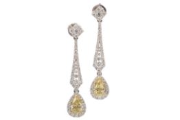 A PAIR OF GIA CERTIFICATED FANCY YELLOW DIAMOND EARRINGS