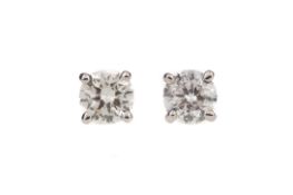 A PAIR OF DIAMOND STUD EARRINGS