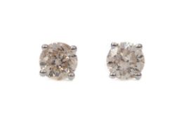 A PAIR OF DIAMOND STUD EARRINGS