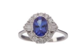 A TANZANITE AND DIAMOND RING