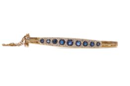 A SAPPHIRE AND DIAMOND BANGLE