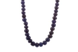 A CARVED SAPPHIRE NECKLACE