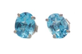 A PAIR OF BLUE TOPAZ STUD EARRINGS