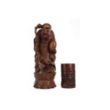 A CHINESE CARVED WOOD FIGURE OF SHAO LAO AND A BRUSH POT