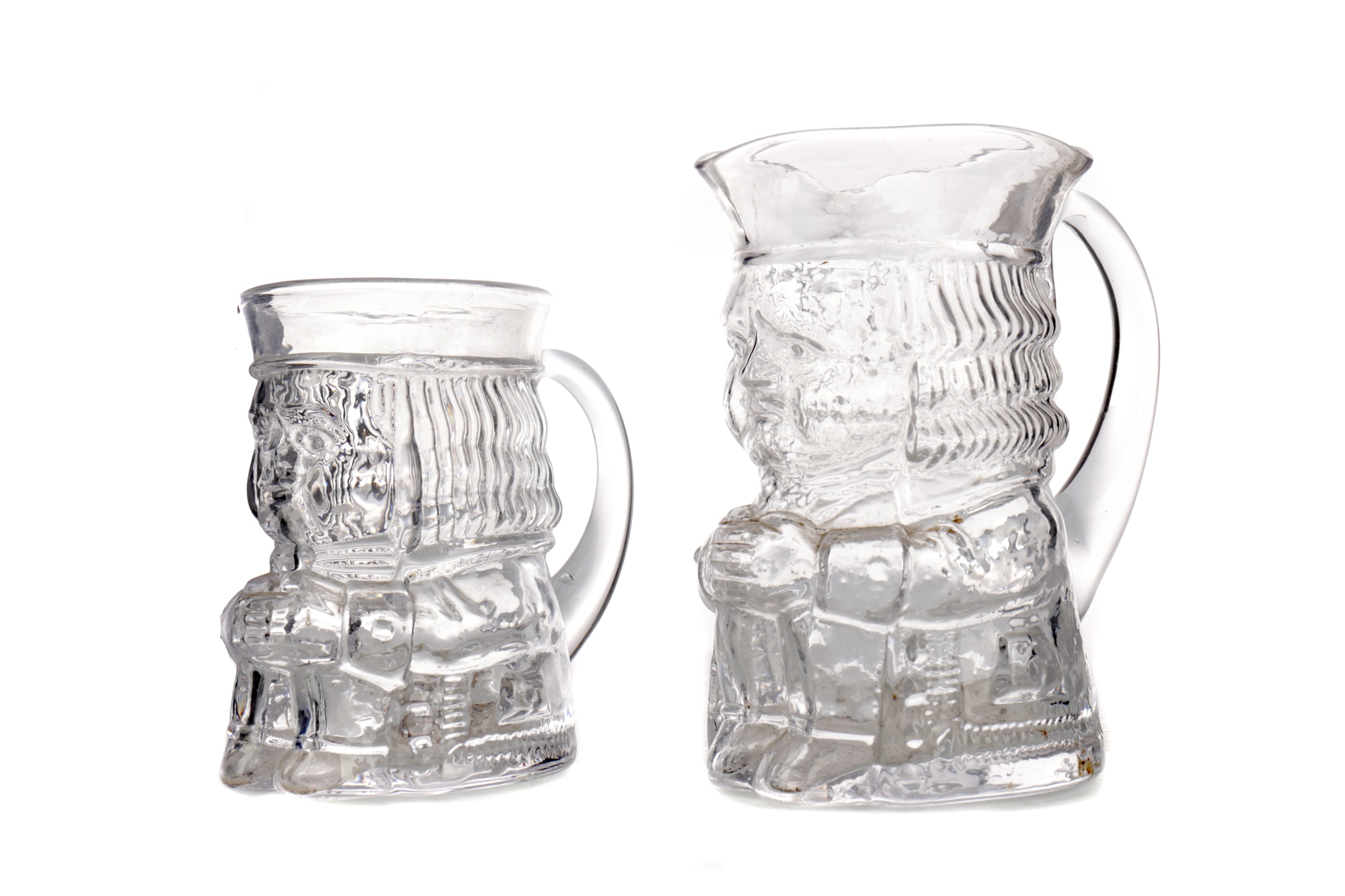 A PAIR OF LATE VICTORIAN GRADUATED GLASS CHARACTER JUGS