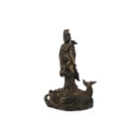 A CHINESE BRONZE FIGURE OF GUANYIN