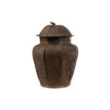 A MIDDLE EASTERN BRONZED METAL OCTAGONAL CANISTER