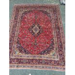 A PERSIAN HAND KNOTTED WOOL CARPET
