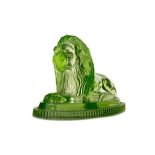 A LATE VICTORIAN URANIUM GLASS FIGURE OF A RECUMBANT LION