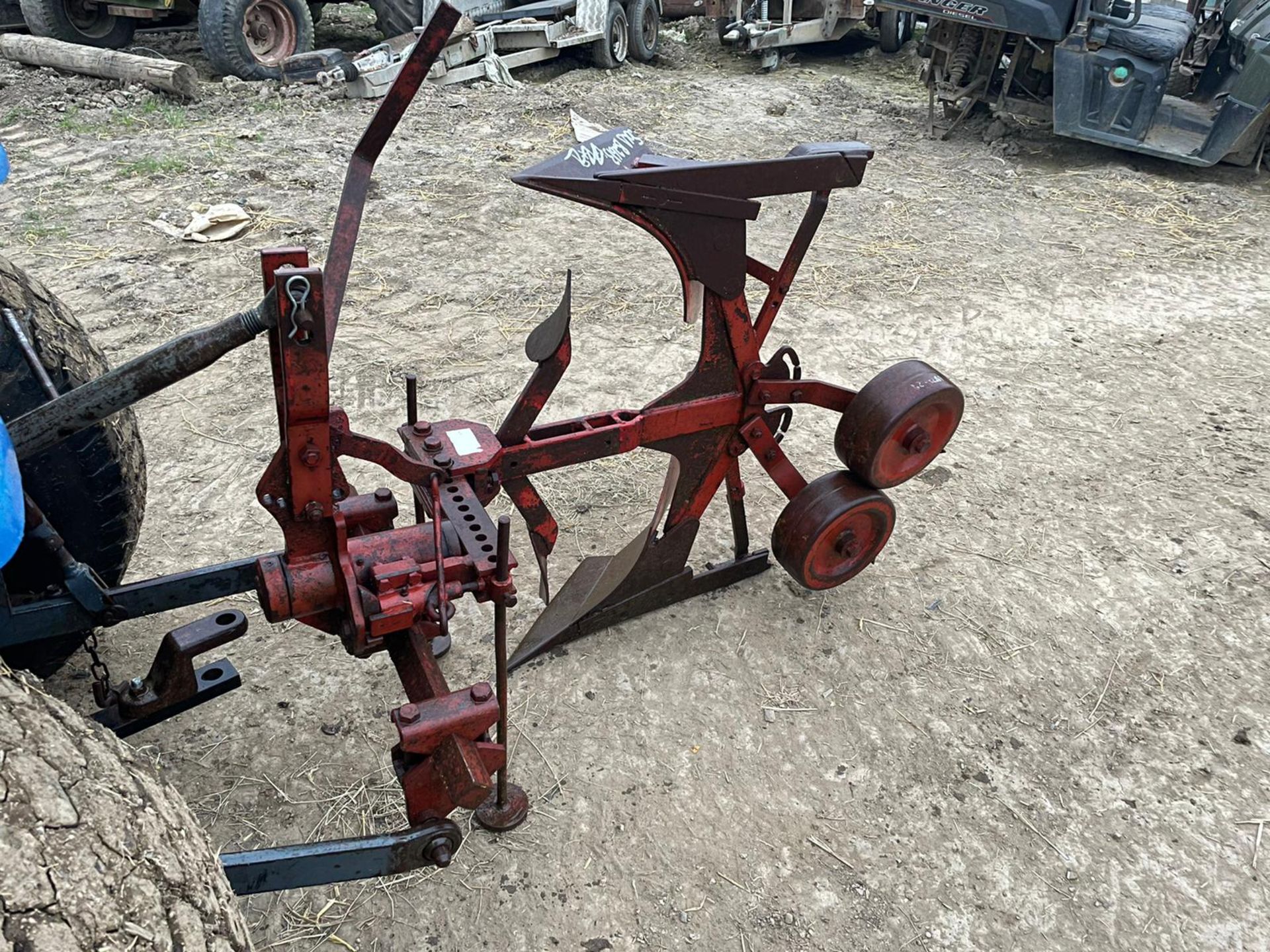 RED SINGLE FURROW REVERSIBLE PLOUGH, SUITABLE FOR COMPACT TRACTOR *PLUS VAT*