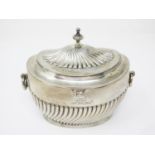 A Victorian silver oval gadroon fluted Tea Caddy with regimental crest and ring handles, London 1896