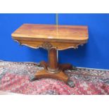 A 19th Century rosewood Card Table with fold-over top on octagonal column, the platform base with