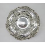 A sterling silver circular Bowl with lily border, engraved initials, 11 3/4 in diameter, 460 gms.