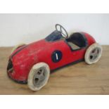 A mid 20th Century Pedal Car with red and blue livery, with pneumatic tyres, requires some