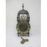 An 18th Century style Lantern Clock with later movement, brass chapter ring and striking on a