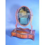 A 19th Century mahogany Dressing Mirror with oval plate, floral marquetry inlay and fitted three