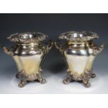 A pair of plated Wine Coolers having moulded fruiting vine borders, two scroll handles on four